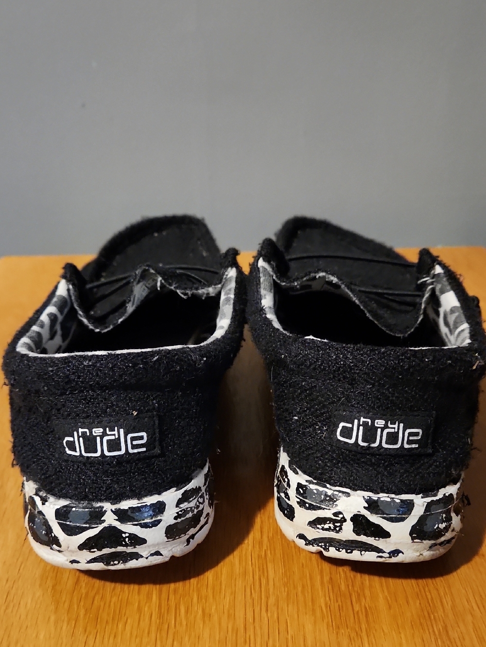 Hey Dude Womens Black Slip-On Shoes with White Patterned Soles